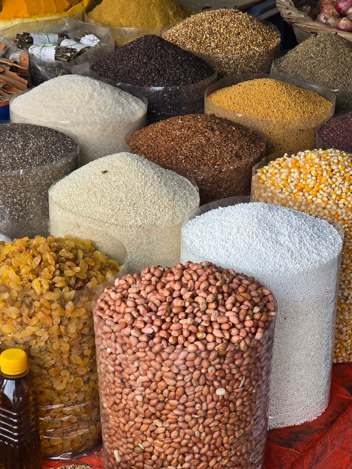 Mastering the First Impression: Your intriguing post title goes here An array of grains and seeds on display in a Dhaka market, showcasing diverse textures and colors.